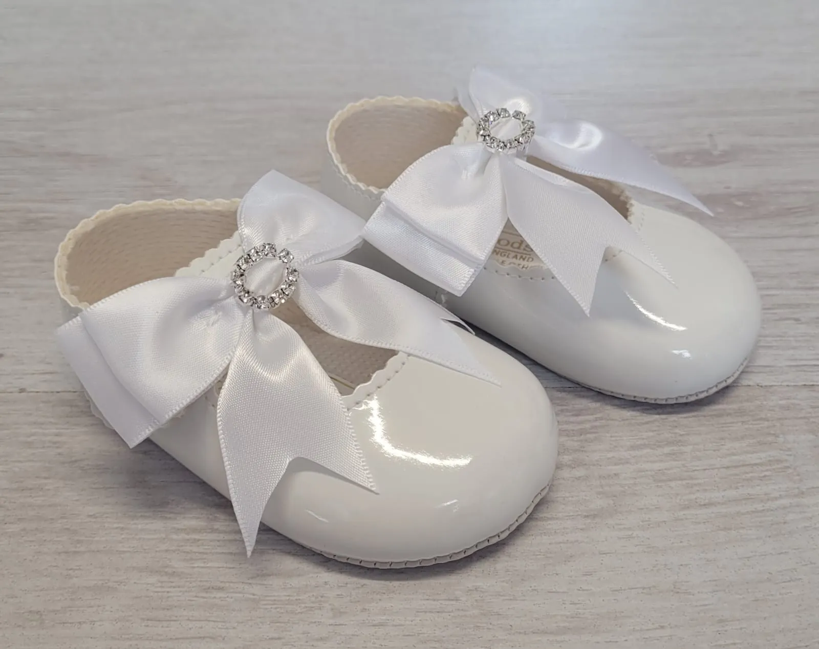 White diamanté bow soft sole shoes